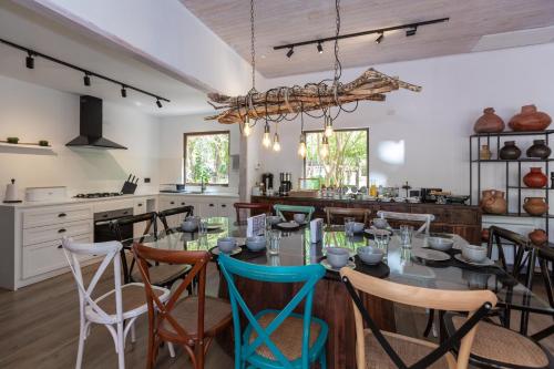 a dining room with a long table and chairs at Casa Solcor Boutique Bed & Breakfast in San Pedro de Atacama