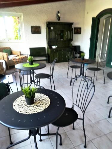 a group of tables and chairs in a room at Casa Malo' in Ischia