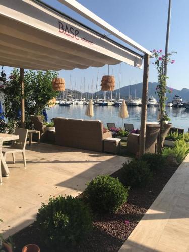 a patio with couches and a view of the water at Base Selimiye in Marmaris