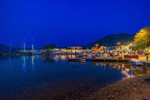 a marina at night with boats in the water at Base Selimiye in Marmaris