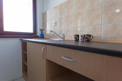 A kitchen or kitchenette at Angjeleski Apartments