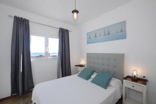 Postel nebo postele na pokoji v ubytování Fischer Home Roque del Este