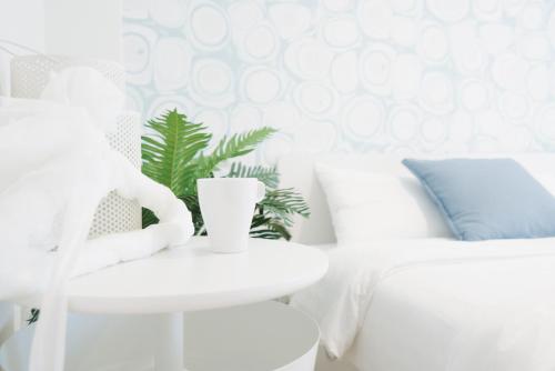 En eller flere senge i et værelse på Shinjuku Mermaid Apartment