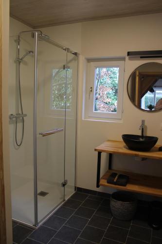 a bathroom with a shower and a sink at 't Jongehof 