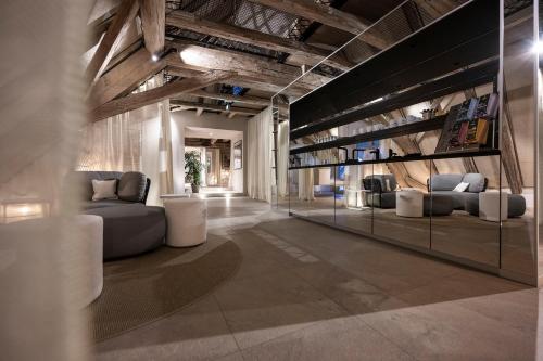 a lobby with couches and chairs in a building at HOTEL & SPA Goldene Rose in Dinkelsbühl