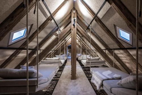 a room with a bunch of beds in a building at HOTEL & SPA Goldene Rose in Dinkelsbühl
