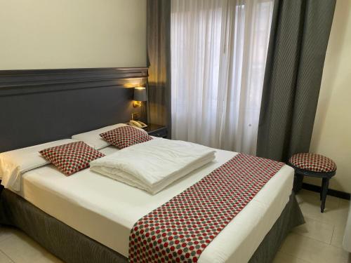 Postel nebo postele na pokoji v ubytování Hotel Estée