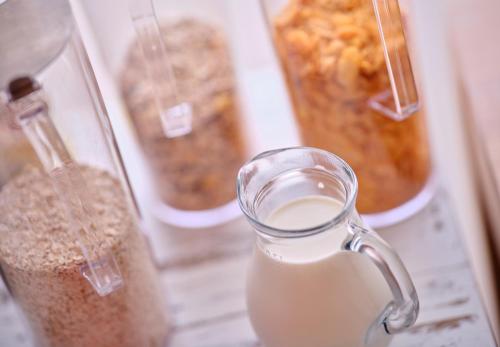 a glass jar of milk and other containers of food at Le 24 Hotel in Spa