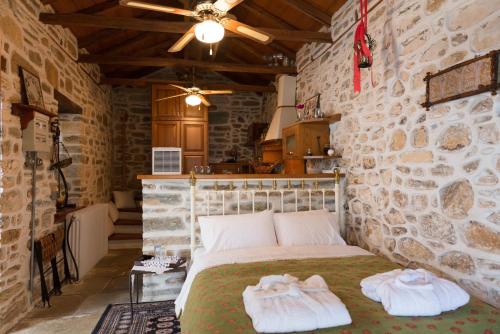 En eller flere senge i et værelse på Vogiatzopoulou Guesthouse