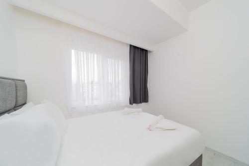 Postel nebo postele na pokoji v ubytování Modern and Comfortable Apartment in Muratpasa