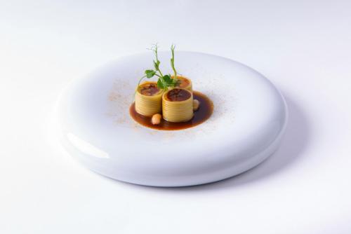 a plate of food with pasta on a white plate at Château Origny - Moulins in Neuvy
