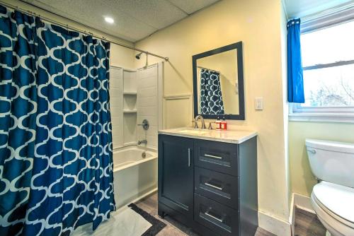 a bathroom with a sink and a toilet and a mirror at Troy Townhome 10 Mi to Downtown Albany! in Troy