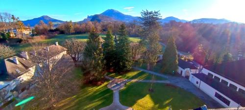 an aerial view of a yard with trees and a building at Johannes Schlössl - Gästehaus der Pallottiner am Mönchsberg in Salzburg