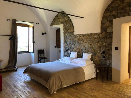 Ένα ή περισσότερα κρεβάτια σε δωμάτιο στο Chambres d'hôtes - Mulino nannaré