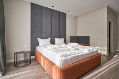Postel nebo postele na pokoji v ubytování Olimp Hotel