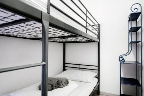 a bedroom with two bunk beds and a ladder at Blue Loft - The House Of Travelers in Como