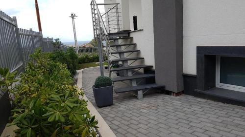 a staircase on the side of a building with a fireplace at Rucoli in Brucoli