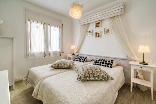 Cama o camas de una habitación en Vivalidays ilaria - Calella