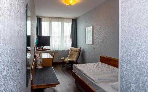En eller flere senge i et værelse på Trip Inn Aschaffenburger Hof