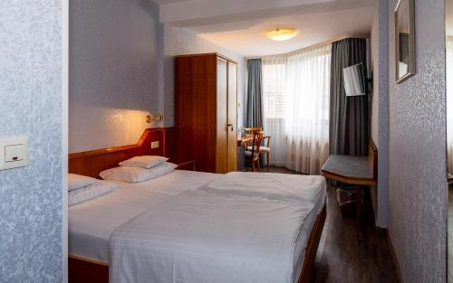 Katil atau katil-katil dalam bilik di Trip Inn Aschaffenburger Hof