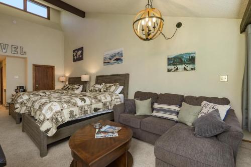 a bedroom with a bed and a couch at Tamarron Lodge Studio - 406 in Durango
