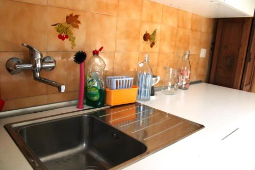 a kitchen counter with a sink and a counter top at Mikasa Balduina Roma in Rome