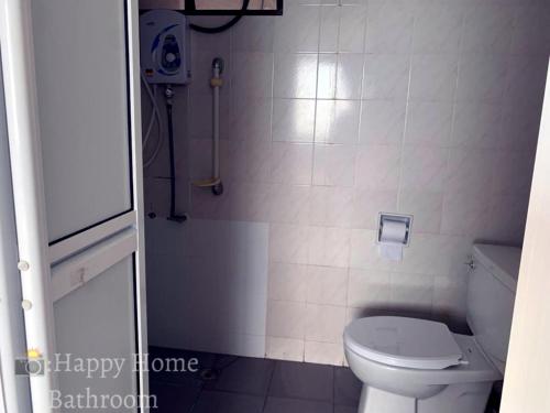 a small bathroom with a toilet and a shower at Happy Home 26 Sri Sayang Batu Ferringhi in Batu Ferringhi