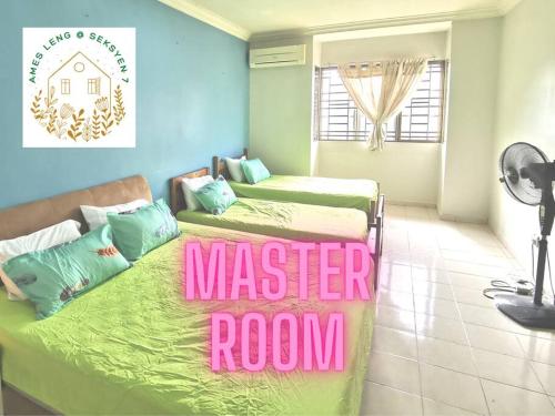 two beds in a room with a master room at Ames Leng I-City Home Sweet Home in Shah Alam