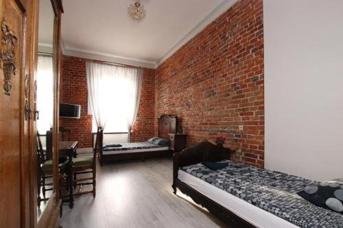 Postel nebo postele na pokoji v ubytování Vanilla Hostel Wrocław