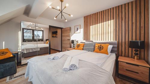 Posteľ alebo postele v izbe v ubytovaní Apartamenty Sun & Snow Resorts C Białka Tatrzańska z sauną