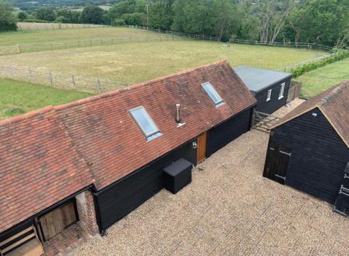 an overhead view of a barn with a roof at Quirky Barn Conversion Crowhurst Battle in Crowhurst