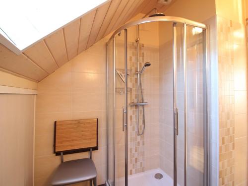 a bathroom with a shower with a glass shower stall at Beau chalet 4 chambres, terrasse, garage, WiFi au Mont-Dore - FR-1-608-223 in Le Mont-Dore