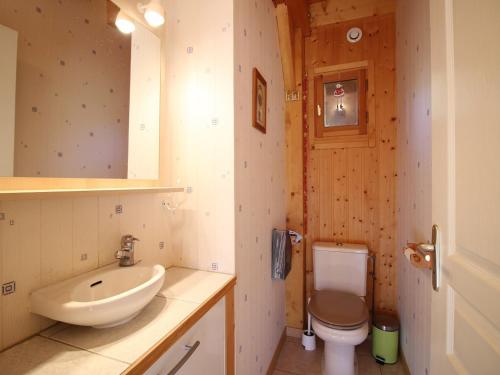 a bathroom with a sink and a toilet at Mont-Dore : Chalet spacieux avec parking et grand terrain - FR-1-608-106 in Le Mont-Dore
