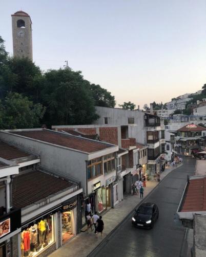 a car driving down a city street with buildings at City Heart Apartments in Ulcinj