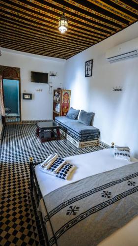 a bedroom with two beds in a room at Riad Green House in Fès