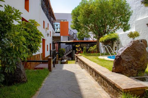 a courtyard of a building with a playground at La casa de theo in Arequipa