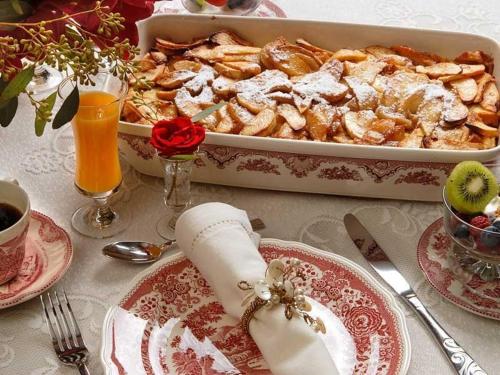 a table with a tray of food and a dish of food at Fisher House Victoria Bed and Breakfast in Victoria