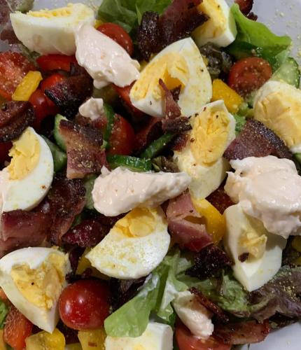 a salad with eggs and vegetables on a plate at Modjadji Estate Lodge & Spa in Grietjie Nature Reserve