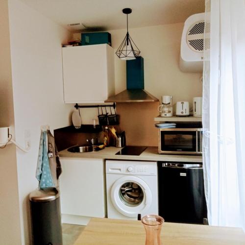 Kuchyň nebo kuchyňský kout v ubytování Le Sweet Home appartement tout confort