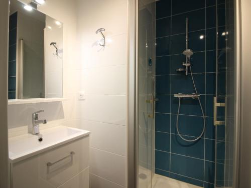 a bathroom with a sink and a shower at Appartement La Bourboule, 3 pièces, 5 personnes - FR-1-608-96 in La Bourboule