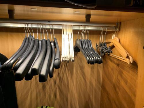 a bunch of cooking utensils hanging on a rack at Fewo Christine in Prien am Chiemsee