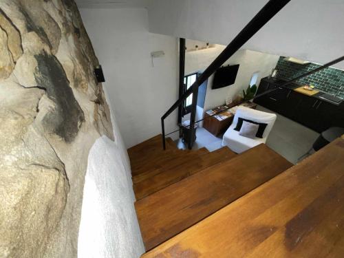 a staircase in a house with a wedding dress at La Martela de Fuentes Casa de diseño rural in Fuentes de León