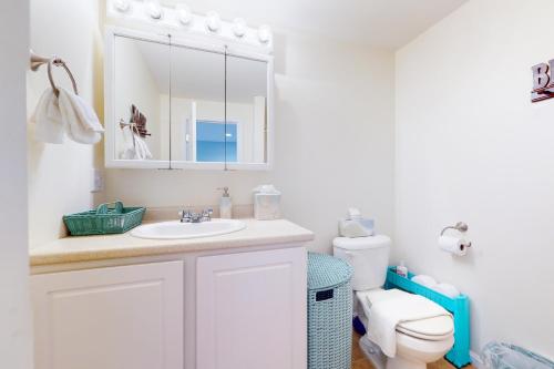 a bathroom with a sink and a toilet at Little Gem at Hampton Beach in Hampton