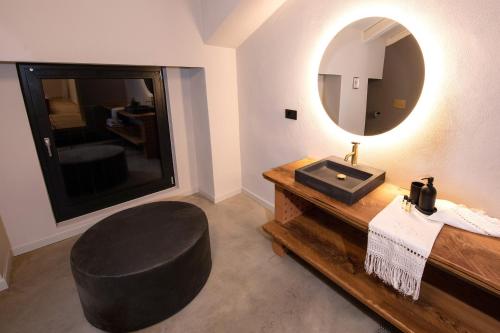 a bathroom with a sink and a mirror at Relais Chiarene in Novello
