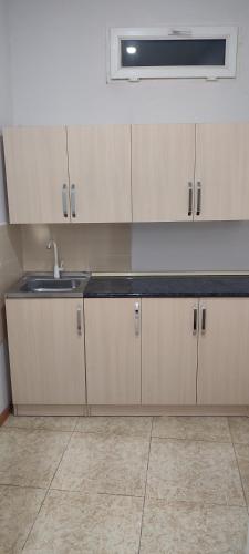 a kitchen with a sink and a counter top at SWEET HOME HOTEL Meghri in Meghri