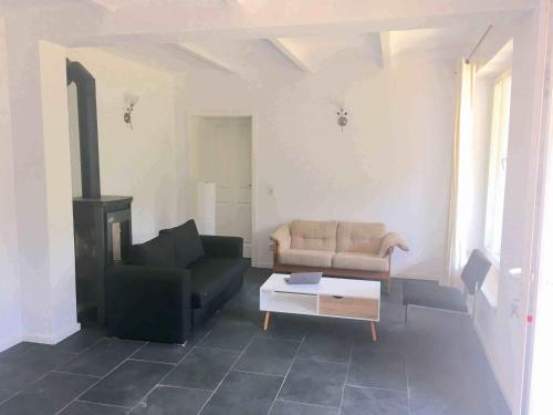 a living room with a couch and a coffee table at Ferienwohnung mit Sauna am Buckowsee in Buckow