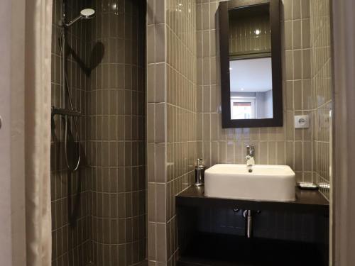 a bathroom with a sink and a mirror at Appartement Avoriaz, 4 pièces, 8 personnes - FR-1-633-13 in Avoriaz