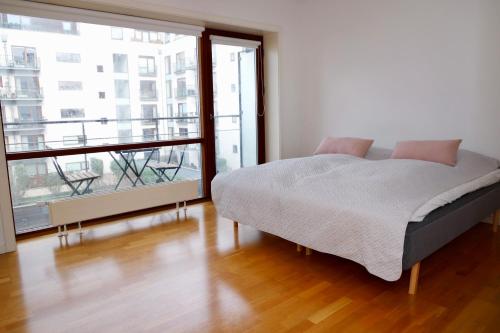 En eller flere senge i et værelse på Scandi-Hygge 2 bedroom apartment in charming Christianshavn