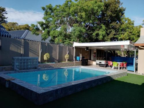 a swimming pool in the backyard of a house at MO MAJOR in Cape Town