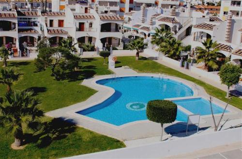 an aerial view of a swimming pool in a resort at Jumilla III in Orihuela Costa